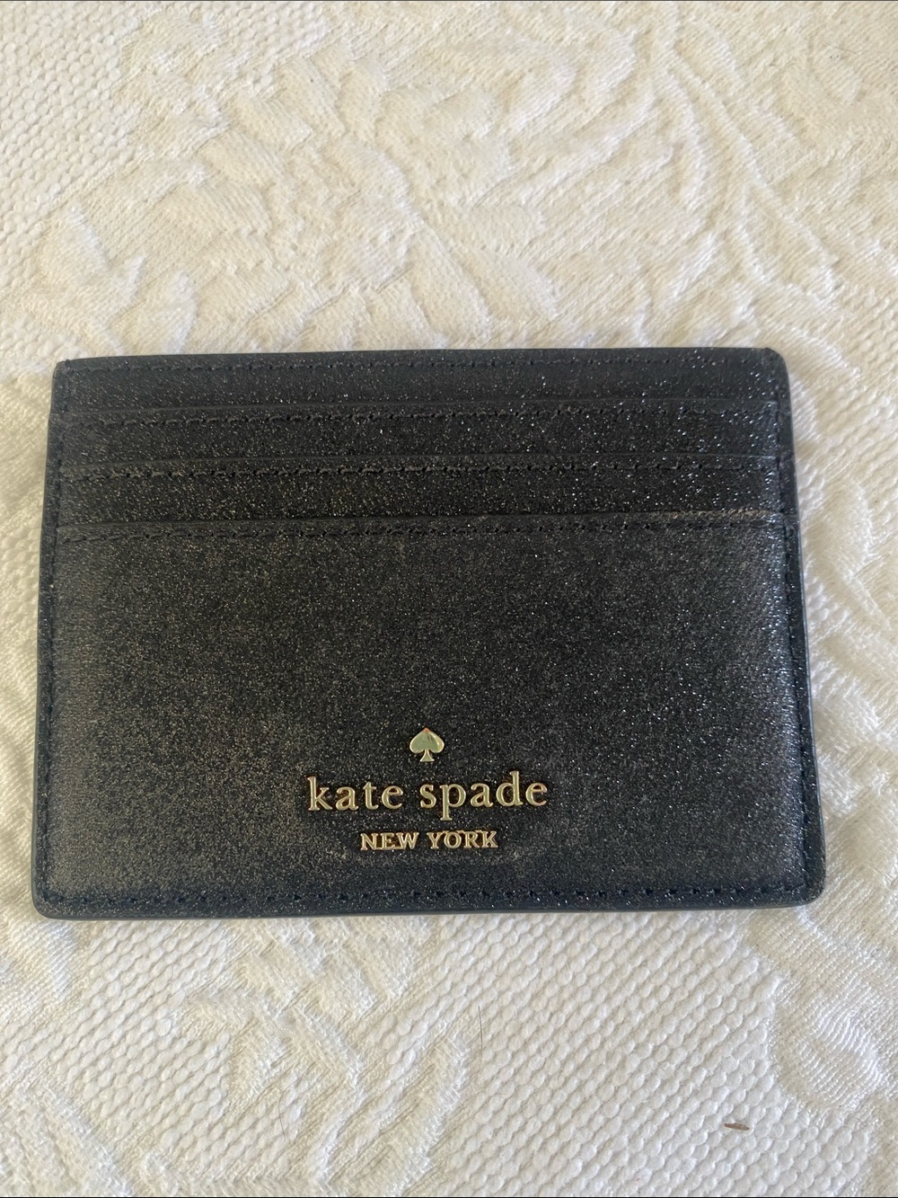 kate spade black glitter leather card holder with gold logo